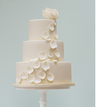 Ivory rose and petals wedding cake